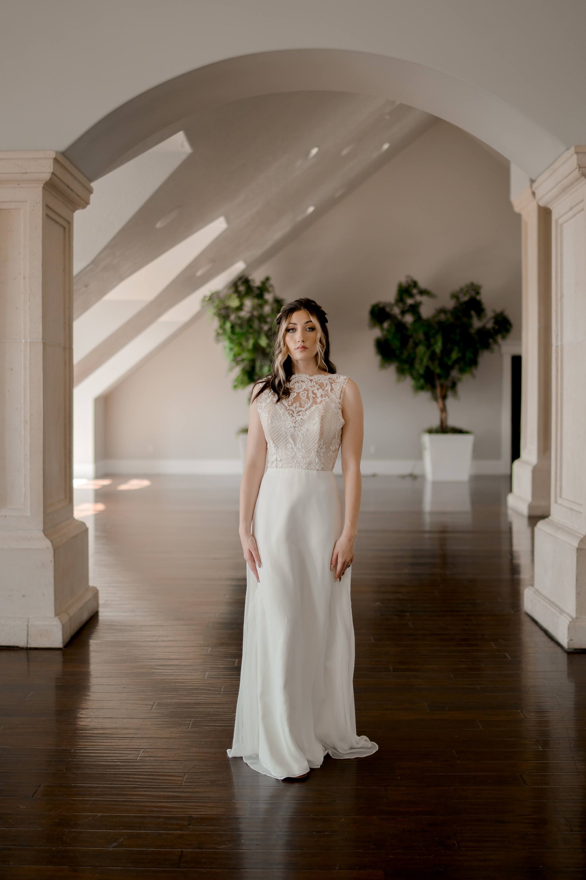 A full length shot of the Winifred gown on a walking bride; the flowing chiffon skirt without princess seams is really the focus here. 