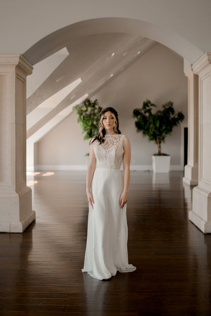 A full length shot of the Winifred gown on a walking bride; the flowing chiffon skirt without princess seams is really the focus here. 