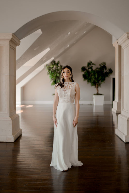 A full length shot of the Winifred gown on a walking bride; the flowing chiffon skirt without princess seams is really the focus here. 