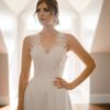 A line with slit, key hole back, sweetheart bridal neckline, beaded lace bodice, ivory beaded lace skirt,