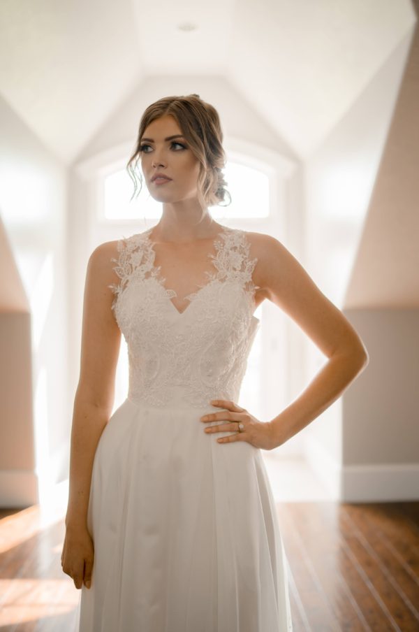 A line with slit, key hole back, sweetheart bridal neckline, beaded lace bodice, ivory beaded lace skirt,