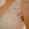 A line with slit, key hole back, sweetheart bridal neckline, beaded lace bodice, ivory beaded lace skirt,