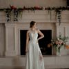 A line with slit, key hole back, sweetheart bridal neckline, beaded lace bodice, ivory beaded lace skirt,