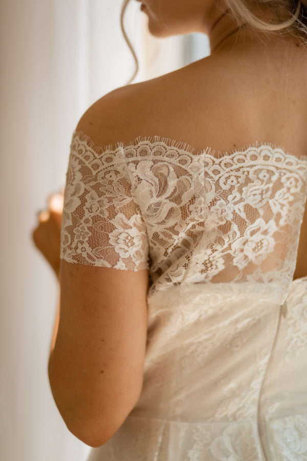 simple lace bridal dress, flat lace, off the shoulder straps, shimmery, crepe and lace