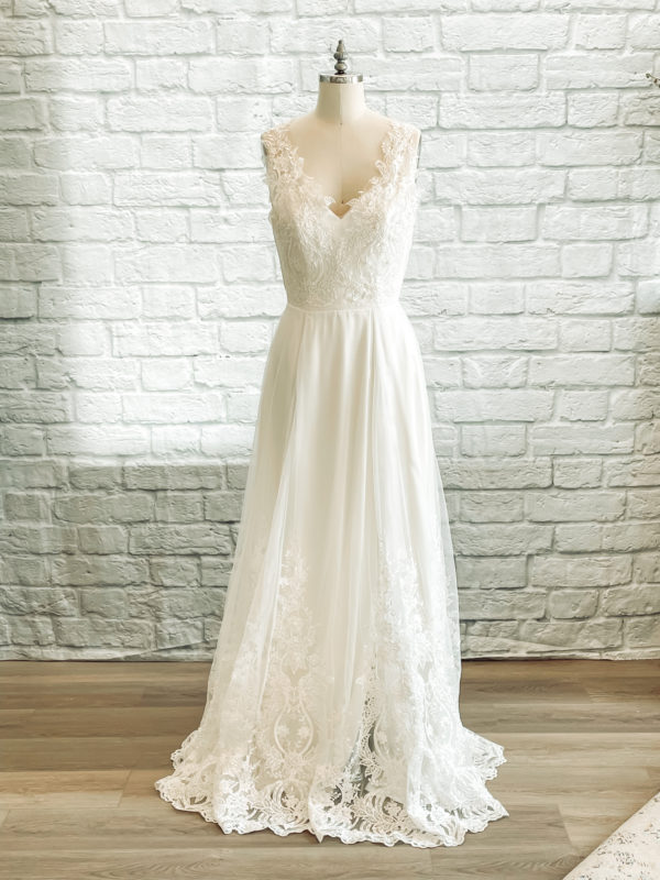 A line with slit, key hole back, sweetheart bridal neckline, beaded lace bodice, ivory beaded lace skirt,