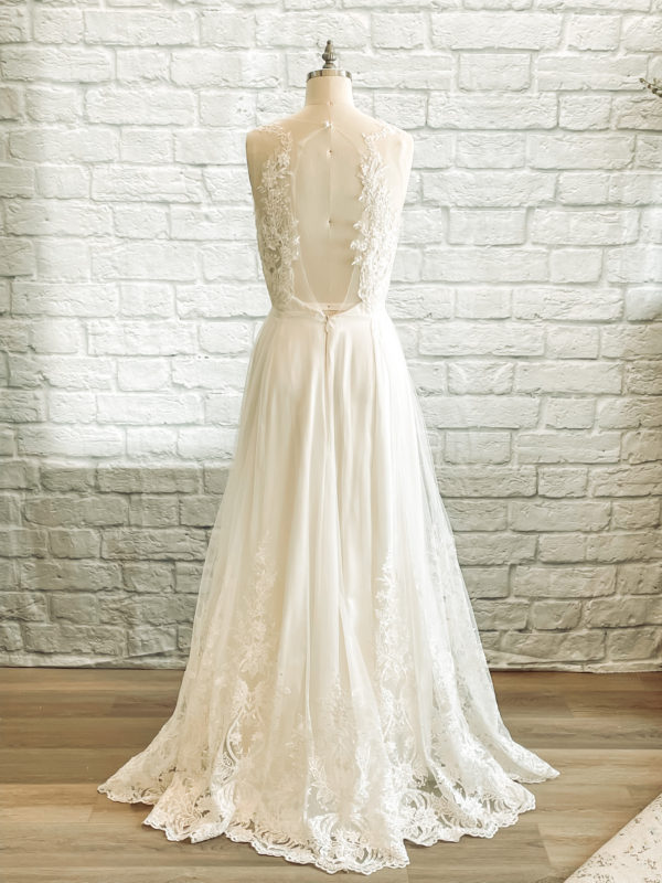 A line with slit, key hole back, sweetheart bridal neckline, beaded lace bodice, ivory beaded lace skirt,